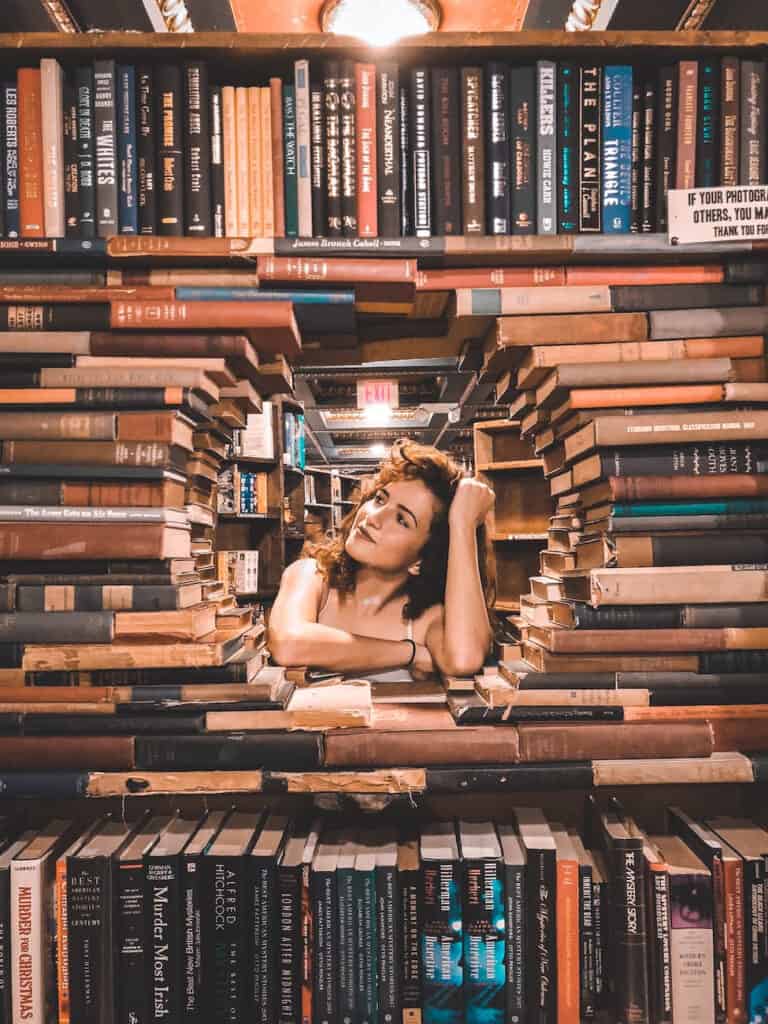 Girl surrounded by Books